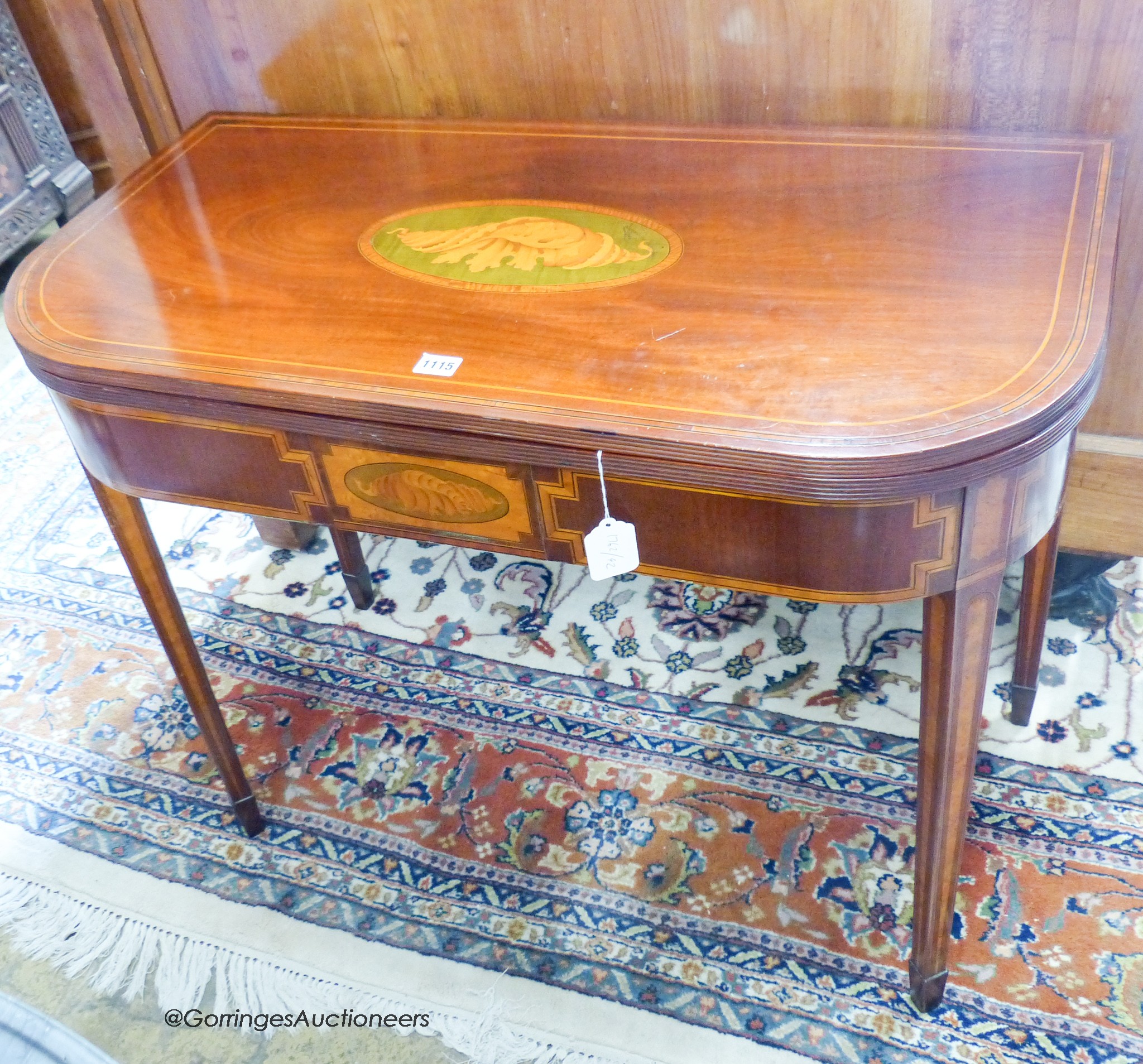 A George IV inlaid mahogany folding card table, width 91cm, depth 45cm, height 73cm